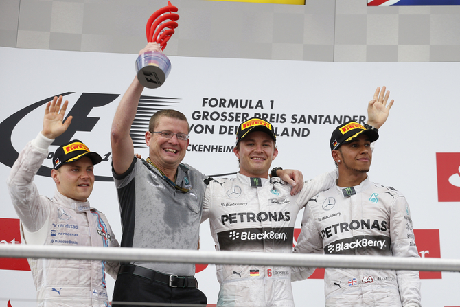 Rosberg went up to the podium alongside Valteri Bottas and Lewis Hamilton Rosberg went up to the podium alongside Valteri Bottas and Lewis Hamilton