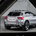 The body slices into the taillights in the rear of the image