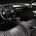 The dashboard is a floating mass of carbon fiber with open footwells 