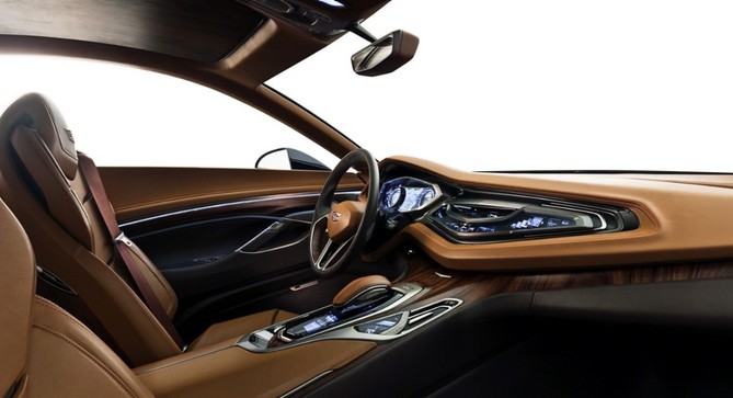 The interior mixes high end materials including rosewood and titanium The interior mixes high end materials including rosewood and titanium