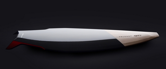 The surfboard is made from carbon fiber and wood The surfboard is made from carbon fiber and wood