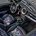Inside, it has brass trim rings and floral-printed trim