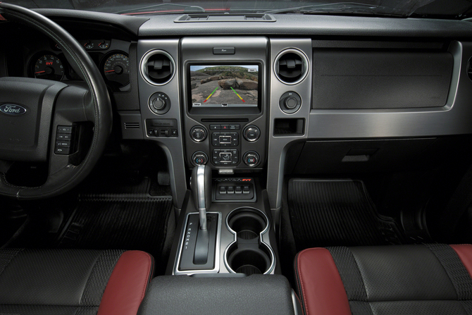 The polished aluminum trim on the center stack is part of the car The polished aluminum trim on the center stack is part of the car