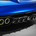 It has a large black diffuser and neon exhaust surrounds