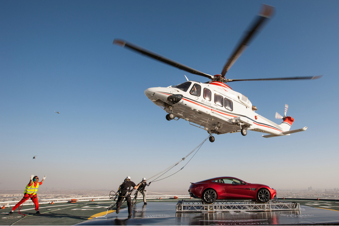 The car was delivered to the helipad be helicopter The car was delivered to the helipad be helicopter