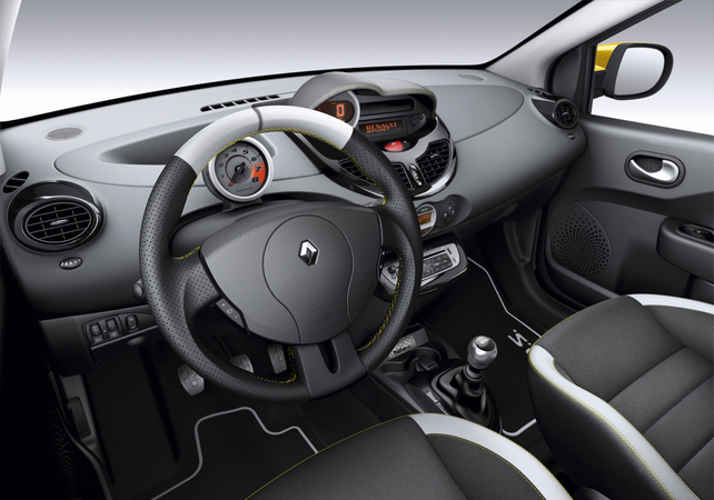The steering wheel, seats and dashboard have yellow stitching The steering wheel, seats and dashboard have yellow stitching