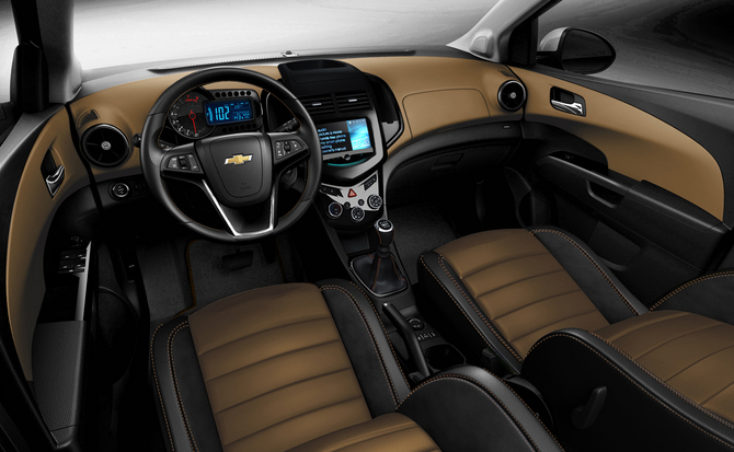 The interior gets a two-tone combination of black and tan with suede. The interior gets a two-tone combination of black and tan with suede.