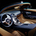 The interior offers a mix of brown and blue leather with blue stitching.