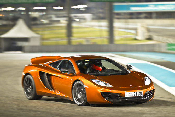 As part of the opening, McLaren created a film of the MP4-12C around the Yas Marina circuit As part of the opening, McLaren created a film of the MP4-12C around the Yas Marina circuit
