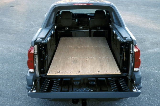 The Avalanche converted from SUV to pickup by removing a partition and laying the seats down The Avalanche converted from SUV to pickup by removing a partition and laying the seats down